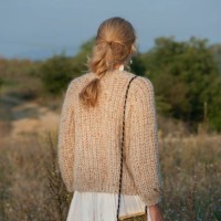 close up of a woman wearing handmade wool sweater - fashion stock pictures, royalty-free photos & images