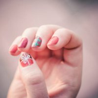 close up of artistic painted nails of a girl with gift symbol draw. - nails art stock pictures, royalty-free photos & images