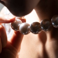 close up of bride holding pearl necklace - fashion stock pictures, royalty-free photos & images