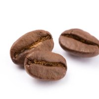 close up of coffee beans against white background - coffee stock pictures, royalty-free photos & images