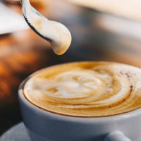 close up of creamy surface of hot latte coffee. - coffee stockfoto's en -beelden