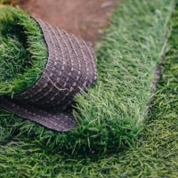 close up of green artificial turf used for covering sport arena or garden. - garden decoration stock pictures, royalty-free photos & images