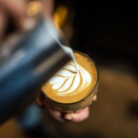 close up of hand pouring coffee latte art - coffee stock pictures, royalty-free photos & images