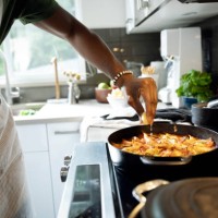 close up of man cooking in kitchen - food photos et images de collection
