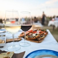 close up of two wine glasses on table in a restaurant outdoors. - food stock pictures, royalty-free photos & images