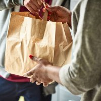 close up of woman receiving take away food delivery - junk food stock pictures, royalty-free photos & images
