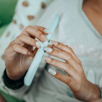 close up of woman with long, slender finger spolishing - nails art stock pictures, royalty-free photos & images