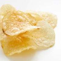 close up on potato chips - junk food stock pictures, royalty-free photos & images