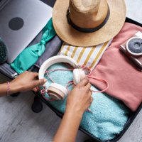 close up photo of black woman'l packing. - travel stock pictures, royalty-free photos & images