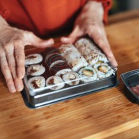 close up photo of woman hands packing takeaway food boxes - junk food stock pictures, royalty-free photos & images