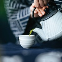 close up photo of woman hands pouring matcha green tea from teapot into a cup - home decoration stock pictures, royalty-free photos & images