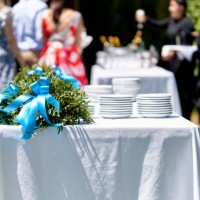 close up view of wedding reception decoration table with white ceramic plates and bouquet - garden decoration stock pictures, royalty-free photos & images