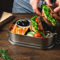 closeup of a woman preparing a healthy lunch box - junk food stock pictures, royalty-free photos & images