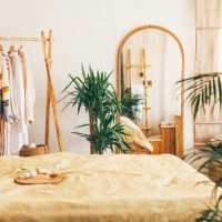 clothes hanging on a hangers near a mirror at home. - home decoration stock pictures, royalty-free photos & images