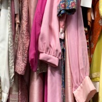 clothing rack of vintage clothing at antique flea market - fashion stock pictures, royalty-free photos & images