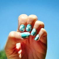 clouds and rain nail art on fingernail against blue sky - nails art stock pictures, royalty-free photos & images