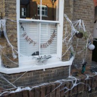 Cobwebs and pumpkins are arranged around a garden to mark Halloween on 31 October 2020 in Windsor, United Kingdom. Halloween celebrations, and in...