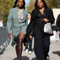 Coco Bassey wears a green oversized blazer jacket ; Kaye Bassey wears a black oversized blazer jacket, outside Stella McCartney, during the...
