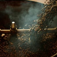 coffee beans dark roast pouring to cooling batch after finish process roasting coffee beans - coffee stockfoto's en -beelden