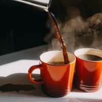 coffee pouring in two mugs - coffee stock pictures, royalty-free photos & images