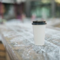 coffee take away stands in winter against of a snowy city background copy space - junk food stock pictures, royalty-free photos & images