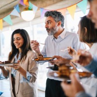 colleagues eating cake at the office birthday party - food stock pictures, royalty-free photos & images