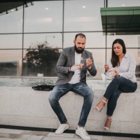 colleagues having a lunch break in the park - junk food stock pictures, royalty-free photos & images