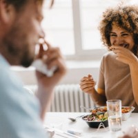 colleagues joking at lunch break, eating healthy food - food stock pictures, royalty-free photos & images
