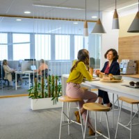 colleagues talking in office - food stock pictures, royalty-free photos & images