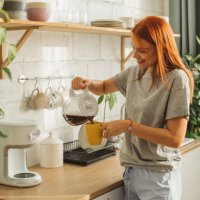 college student at dorm room - coffee stockfoto's en -beelden