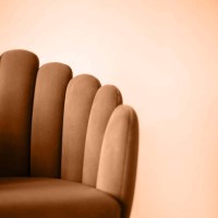 color trend 2024 is peach color. peach background. minimalism. armchair on an empty background. design element. - fashion stock-fotos und bilder