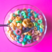 colorful breakfast cereal fills spoon - junk food stock pictures, royalty-free photos & images