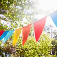 colorful bunting flags/ pennant chain for party decoration in garden - garden decoration stock pictures, royalty-free photos & images