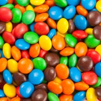 colorful chocolate candy - junk food stock-fotos und bilder