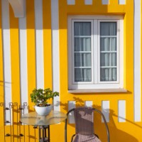 colorful house in costa nova, aveiro, portugal - garden decoration stock pictures, royalty-free photos & images