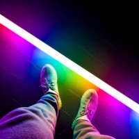 colorful led tube illuminating escenario with person. - fashion stock pictures, royalty-free photos & images