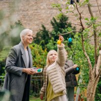 colourful easter eggs in the garden - garden decoration stock pictures, royalty-free photos & images