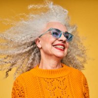 colourful studio portrait of a senior woman - hairstyle stockfoto's en -beelden