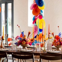 colourful wedding table decoration with flowers and paper articles garlands at banquet hall. - home decoration stock pictures, royalty-free photos & images