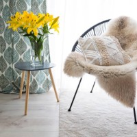 comfortable chair with sheepskin and cushion - home decoration stock pictures, royalty-free photos & images