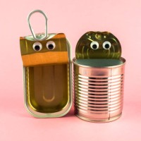 concept of love, romanticism and diversity. two open tin cans with eyes - food stock pictures, royalty-free photos & images