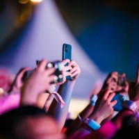 Concert-goers use their smartphones during Karol G concert as part of 'Mañana Será Bonito' Tour at Centro Esportivo Tietê on May 10, 2024 in Sao...