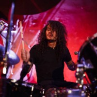 concert of drummer playing drum kit while performing on stage in live event - concert stock pictures, royalty-free photos & images