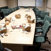 conference room table with take out lunches - junk food stock pictures, royalty-free photos & images