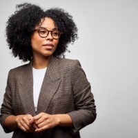 confident african american businesswoman against white background - fashion stock pictures, royalty-free photos & images
