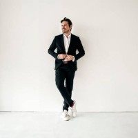confident businessman standing in empty room - fashion stock pictures, royalty-free photos & images