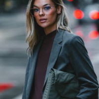 confident businesswoman standing on city street at dusk - fashion stock pictures, royalty-free photos & images