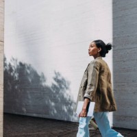confident businesswoman walking outdoors with tablet - fashion stock pictures, royalty-free photos & images