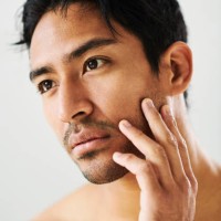 confident, calm and serious handsome male model with clear skin. portrait of a young man with a good skincare routine and a clean face. guy with smooth and glowing skin after shaving - fashion stock pictures, royalty-free pho