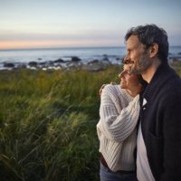 confident couple looking at view at the sea - travel stock pictures, royalty-free photos & images
